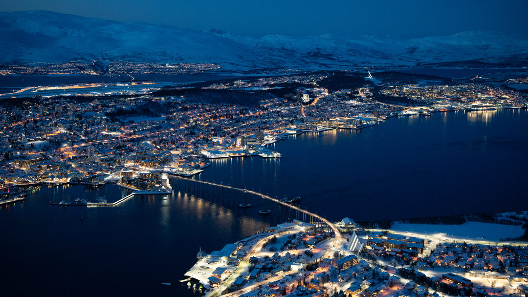 Panoramic winter view of Tromsø city and surrounding Arctic fjords seen from the Fjellheisen view point.