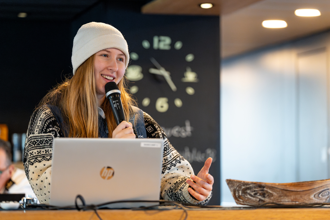 Rødnes guide sharing stories about whales and Arctic wildlife with guests on board