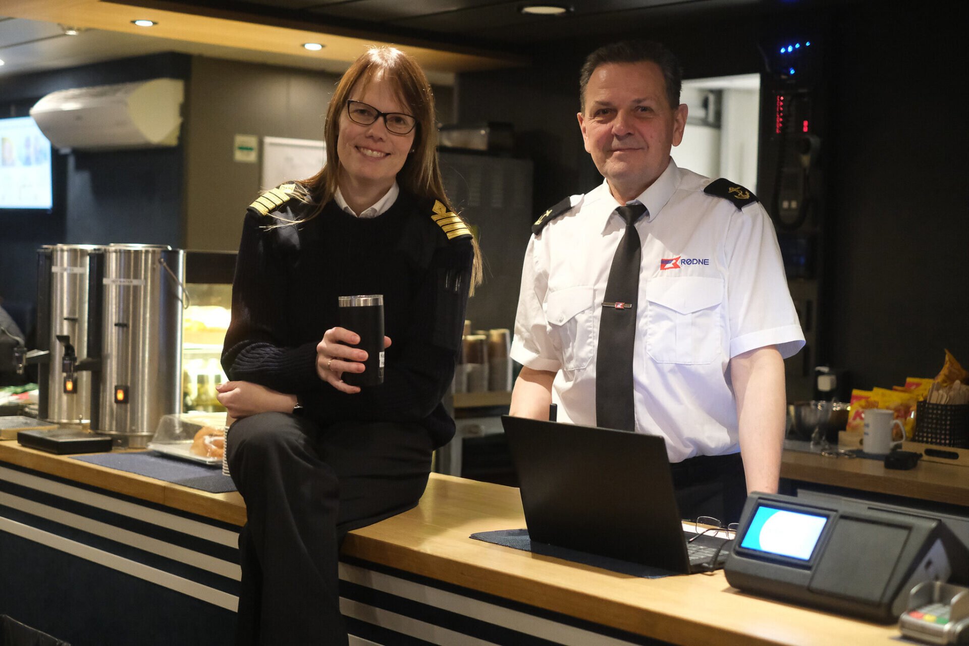 Captain Hanne and crew member Petras welcomes you on board during a Northern Lights cruise in Tromsø.